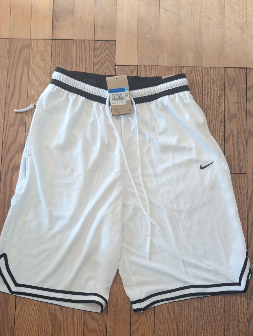 Nike Men’s White Athletic Shorts with Black Trim and Swoosh